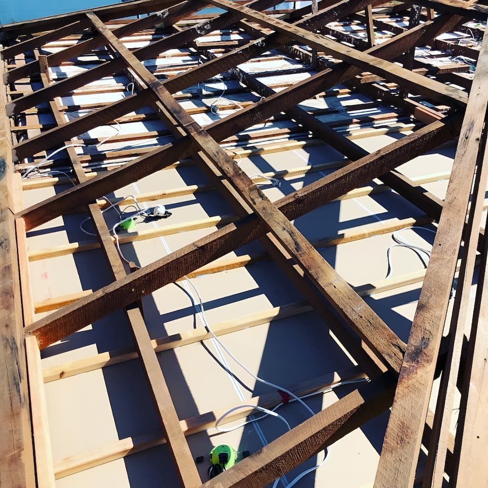 The Roof of a Building is Being Built With Wooden Beams — Veramax Industries in Park Avenue, QLD