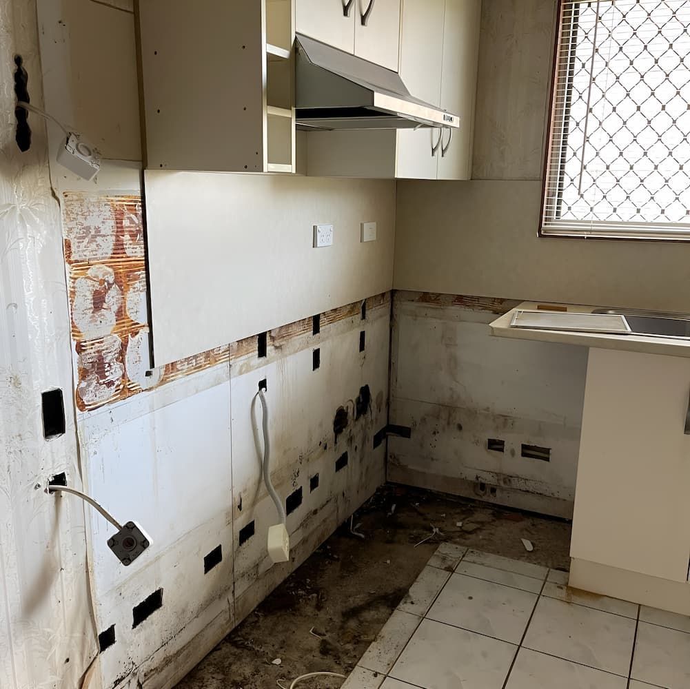 A Kitchen With a Sink , Cabinets , and a Window — Veramax Industries in Park Avenue, QLD