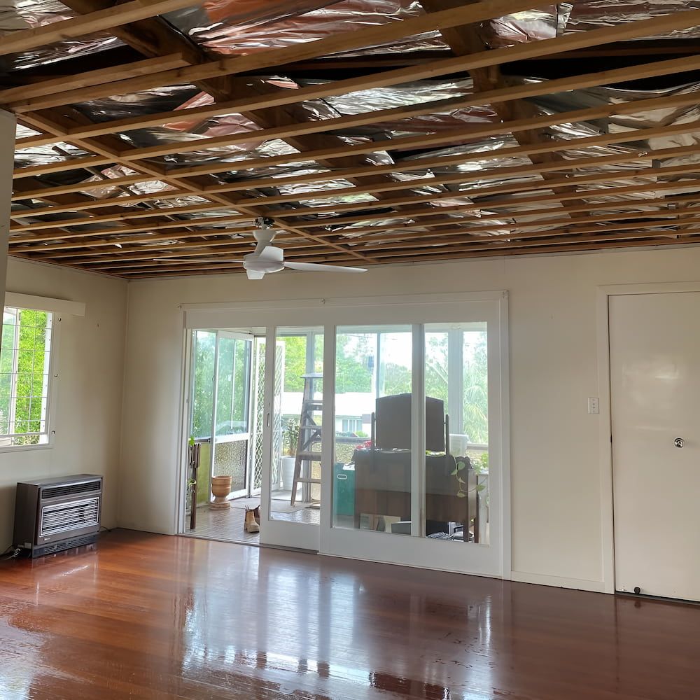 A Living Room With a Ceiling Fan and a Lot of Windows — Veramax Industries in Park Avenue, QLD