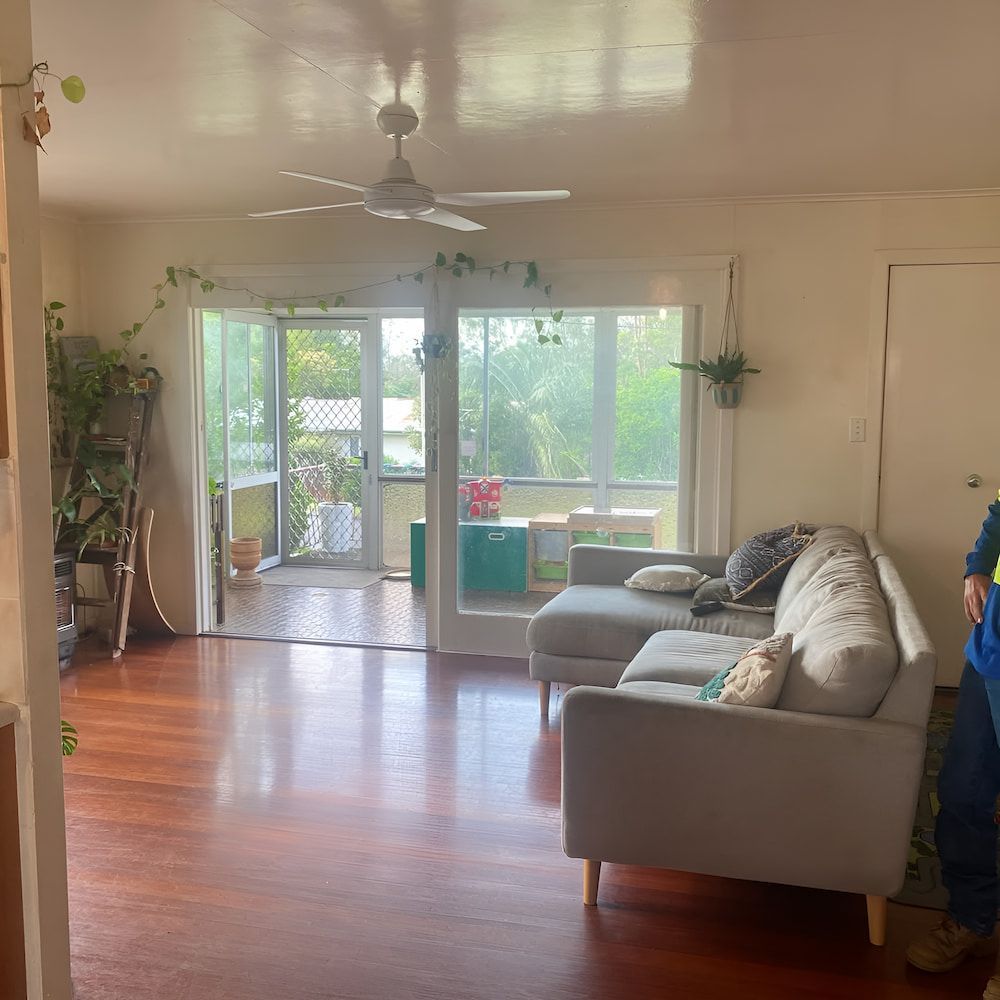 A Living Room With a Couch and a Ceiling Fan — Veramax Industries in Park Avenue, QLD