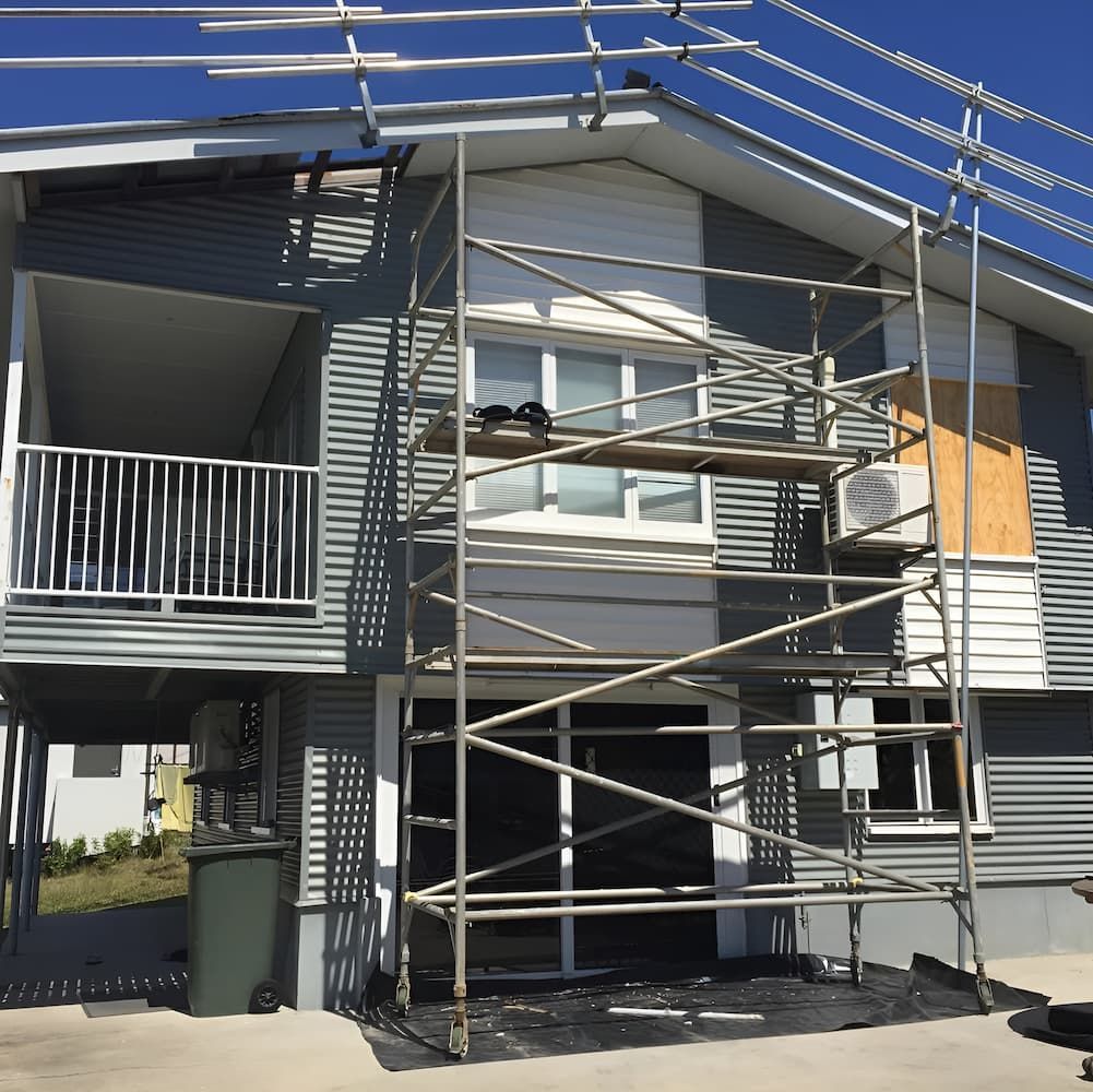 A House With a Scaffolding in Front of It — Veramax Industries in Whitsundays, QLD