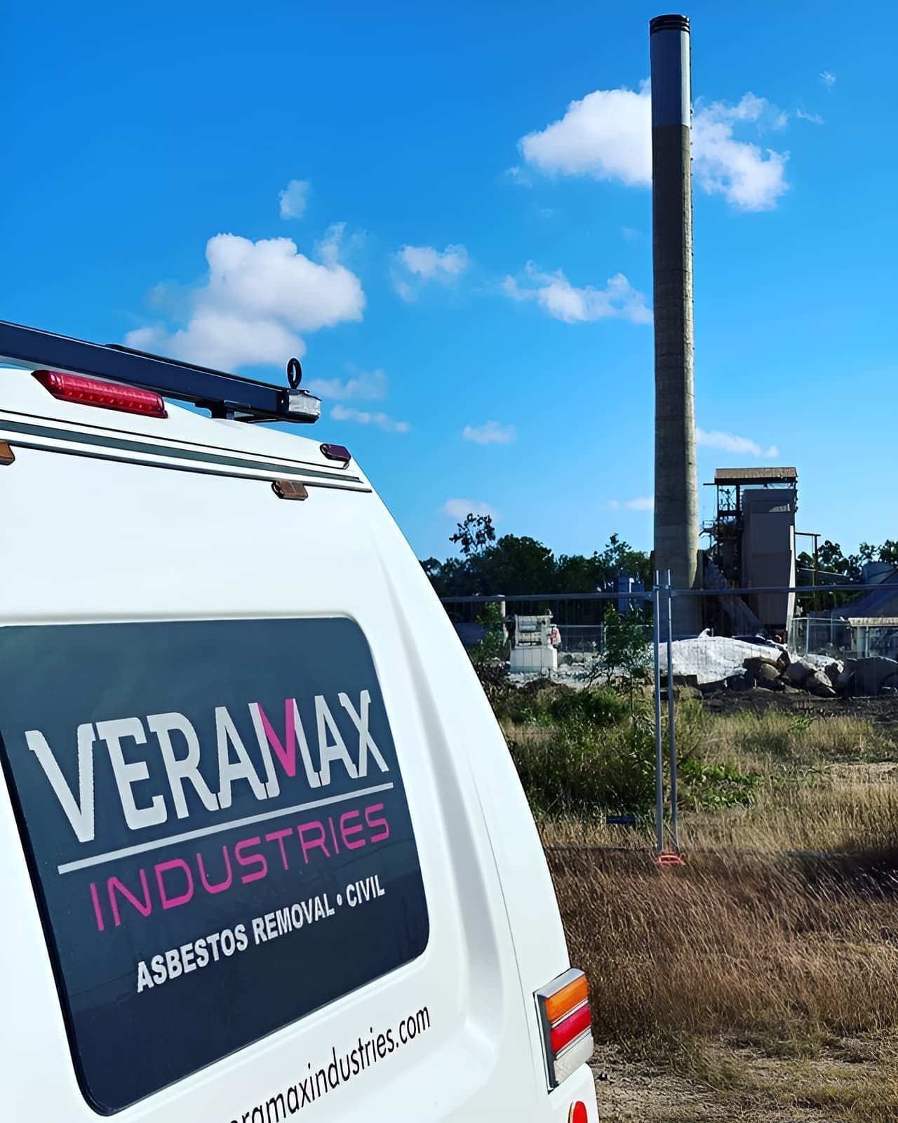 A Veramax Industries Van is Parked in a Field With a Chimney in the Background — Veramax Industries in Park Avenue, QLD