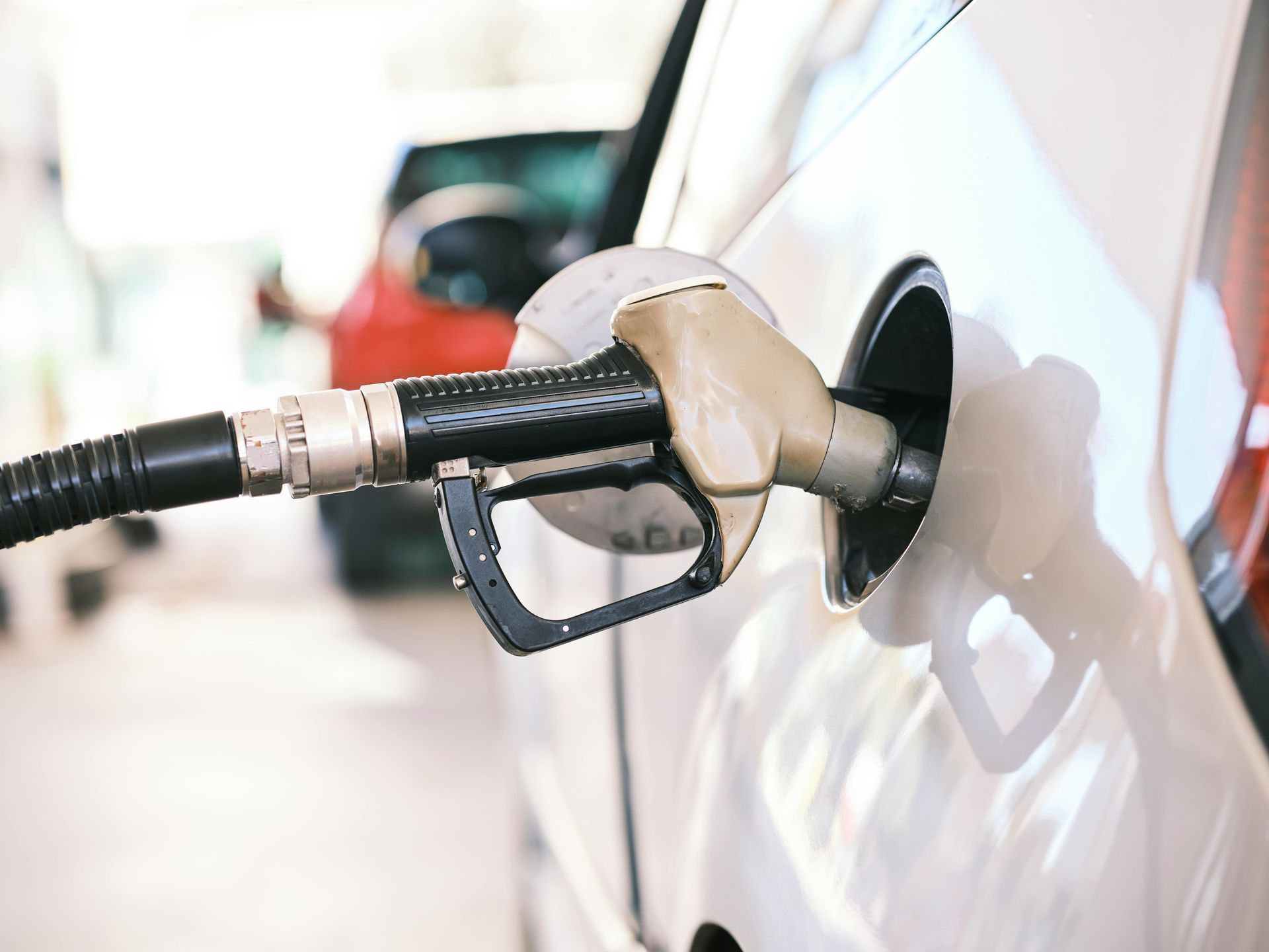 A car is being filled with gas at a gas station.