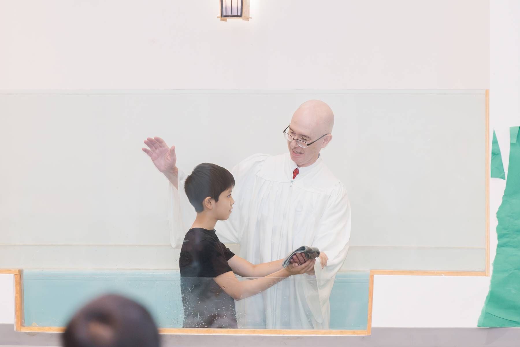 The Lord rejoices as new brother in Christ baptized at Raleigh Chinese Christian Church in Cary, NC