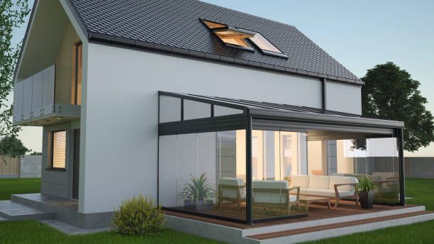 Modern house with attached glass patio enclosure.