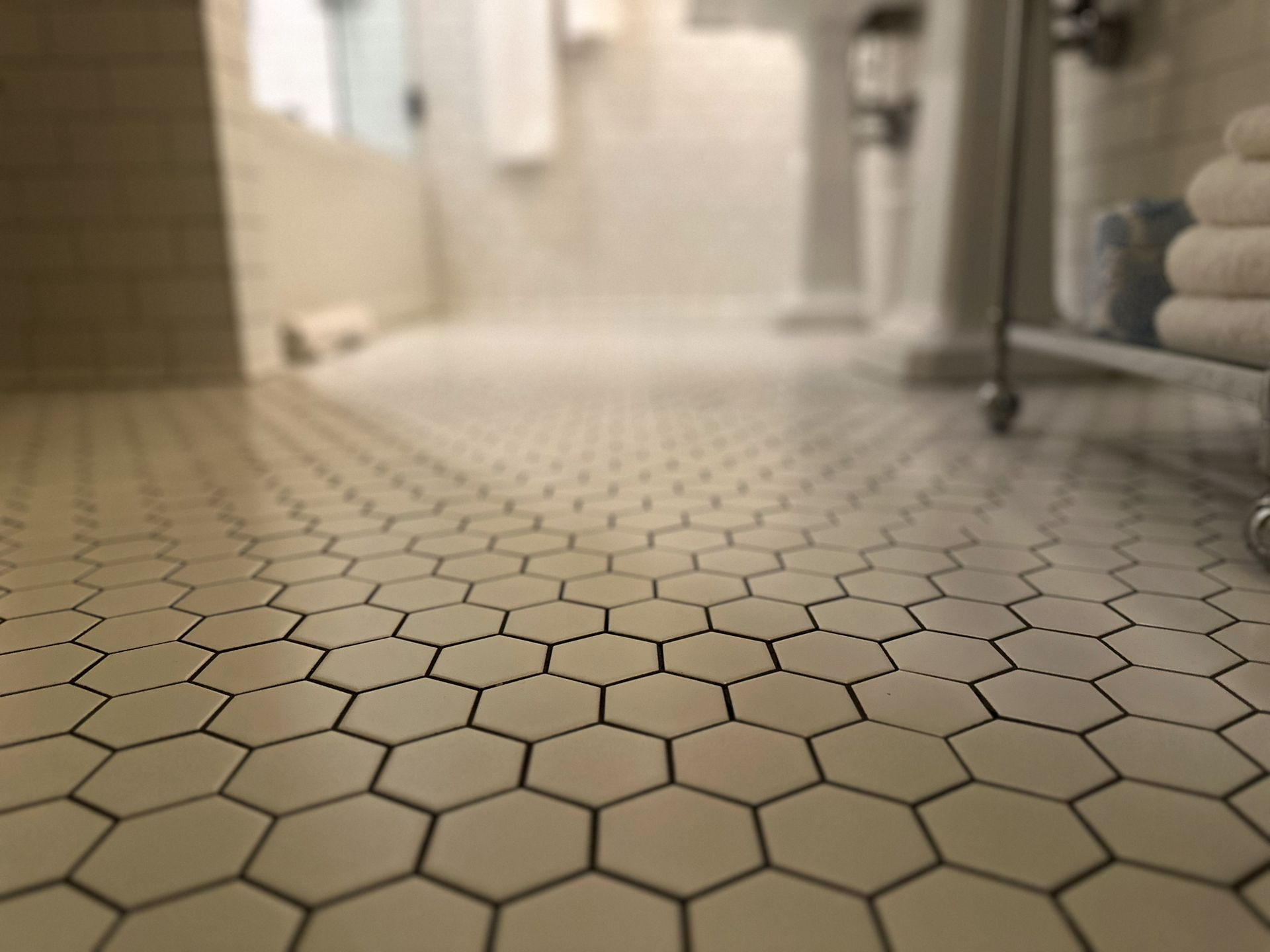 Close-Up of White Hexagon Tiles on A Bathroom Floor — San Antonio, TX — Villa Tile Service
