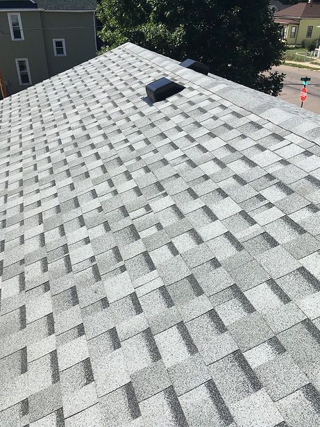 A close up of a roof with a lot of shingles on it.