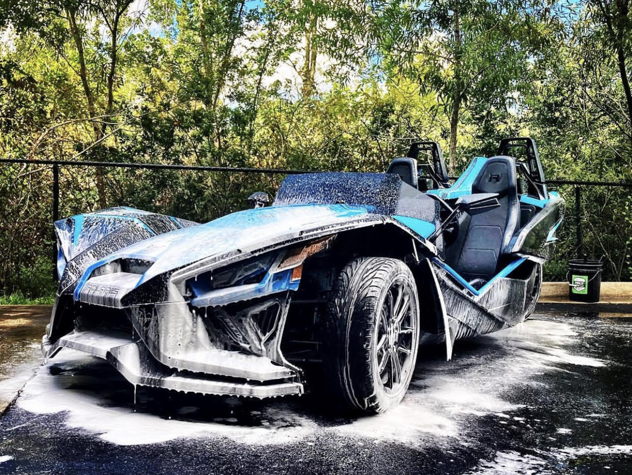 A slingshot is sitting on the ground covered in foam.