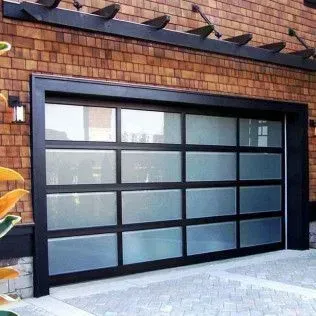 A modern garage door with a brick building in the background.