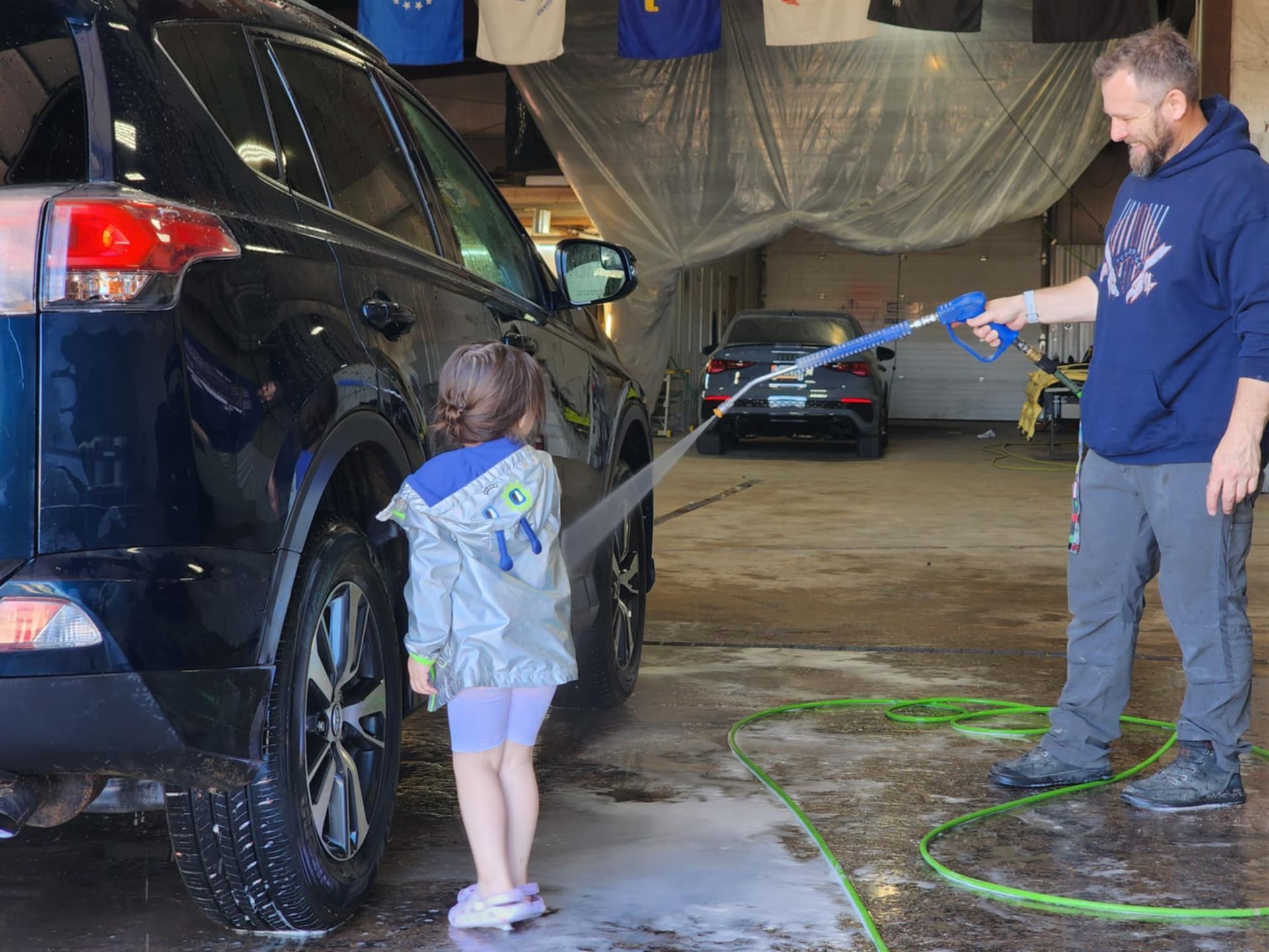 Car's center console with spilled, colorful substances in cup holders and surrounding area, appearing messy.