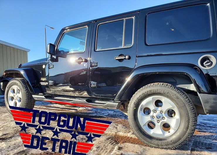 Black Jeep Wrangler parked outdoors with 
