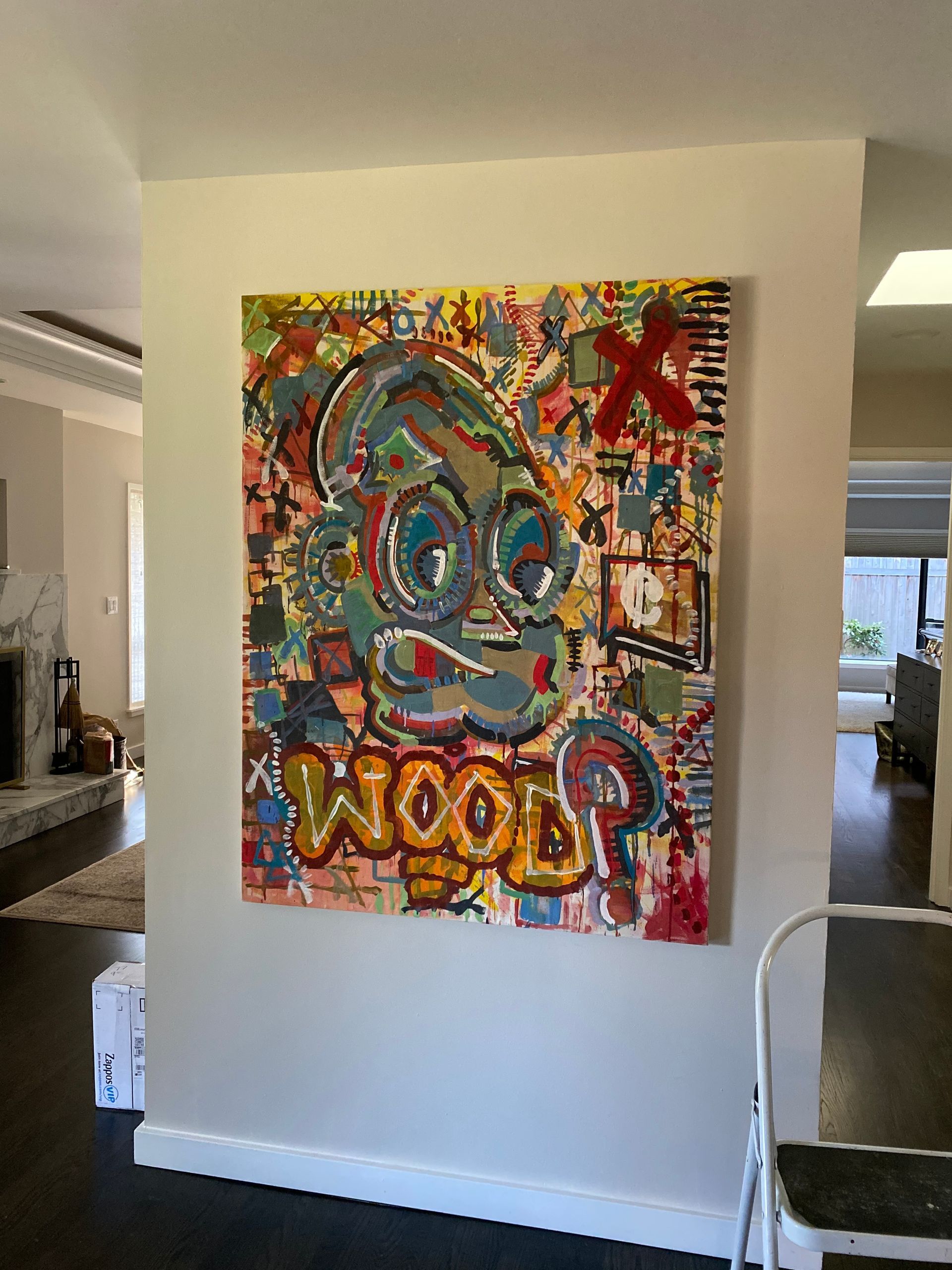 Colorful artwork of a cartoon character on a tan wall, 