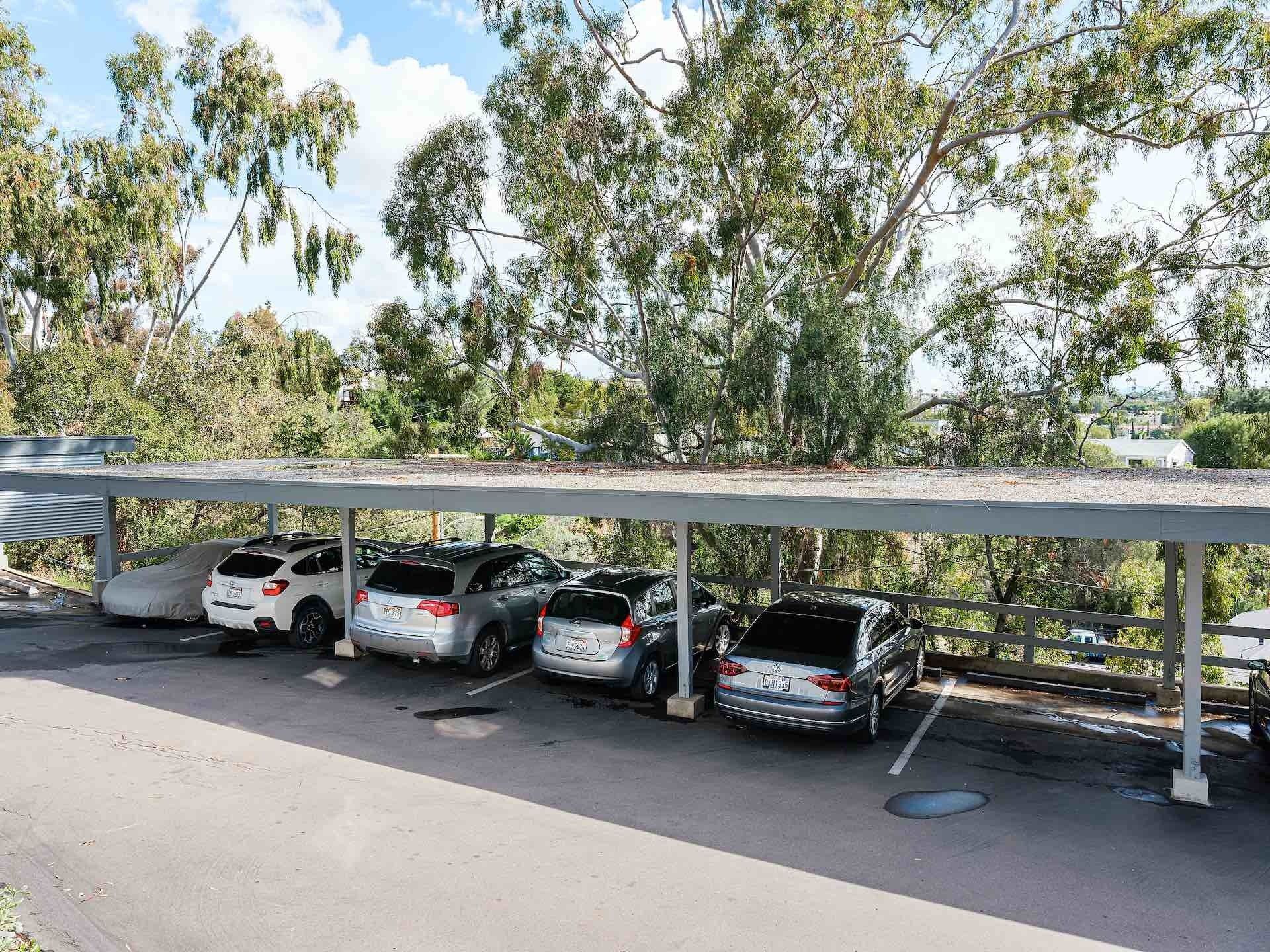 View overlooking covered carport parking near apartments
