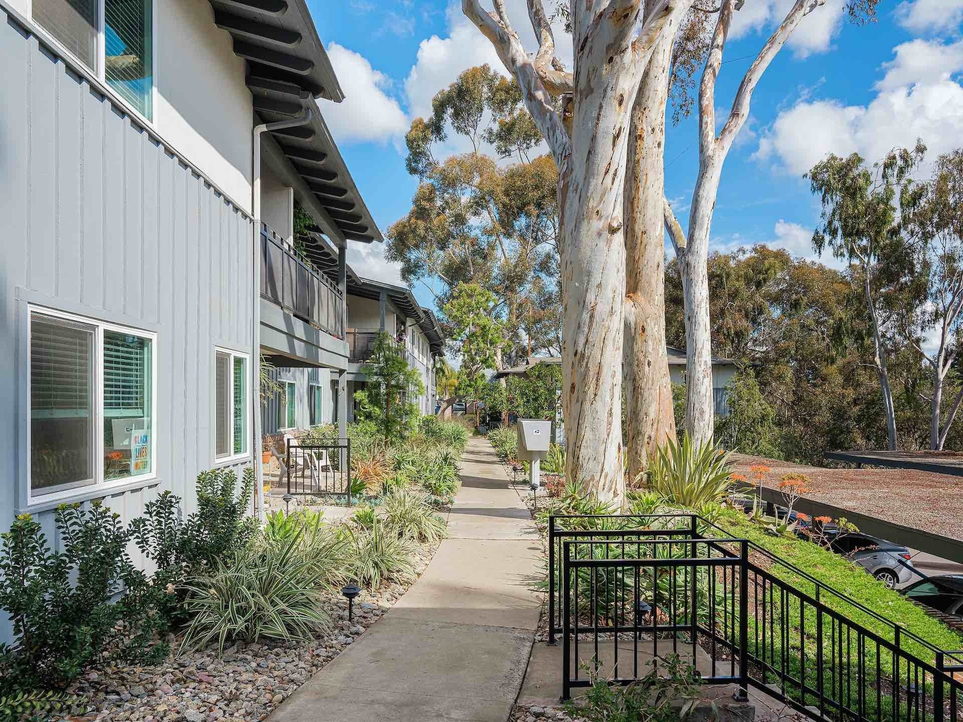 Alternate view of exterior walkway of apartment complex