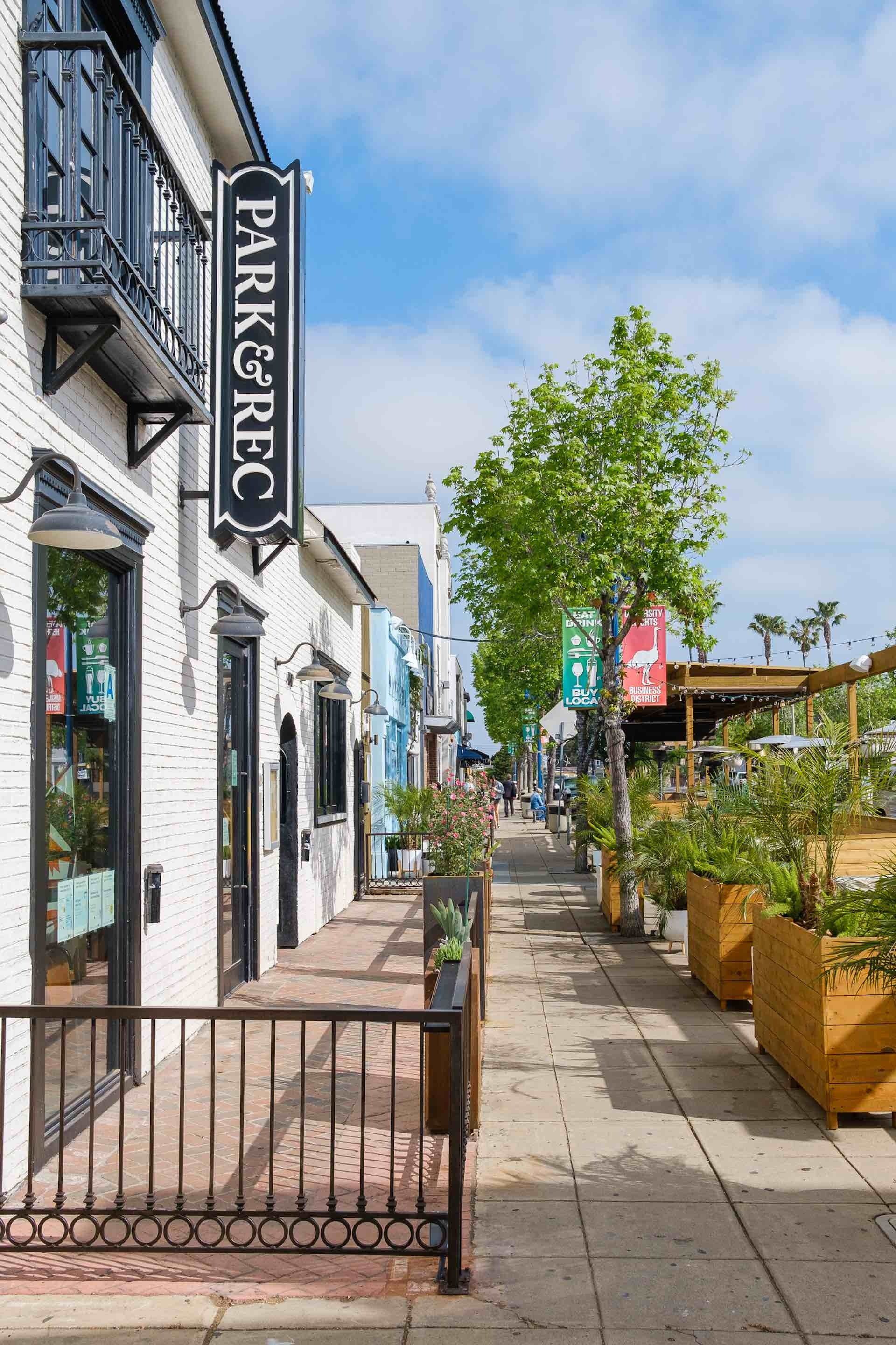 Sidewalk downtown with businesses and outside seating