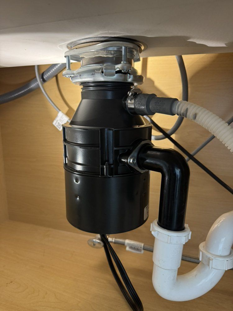 A sink with a garbage disposal attached to it