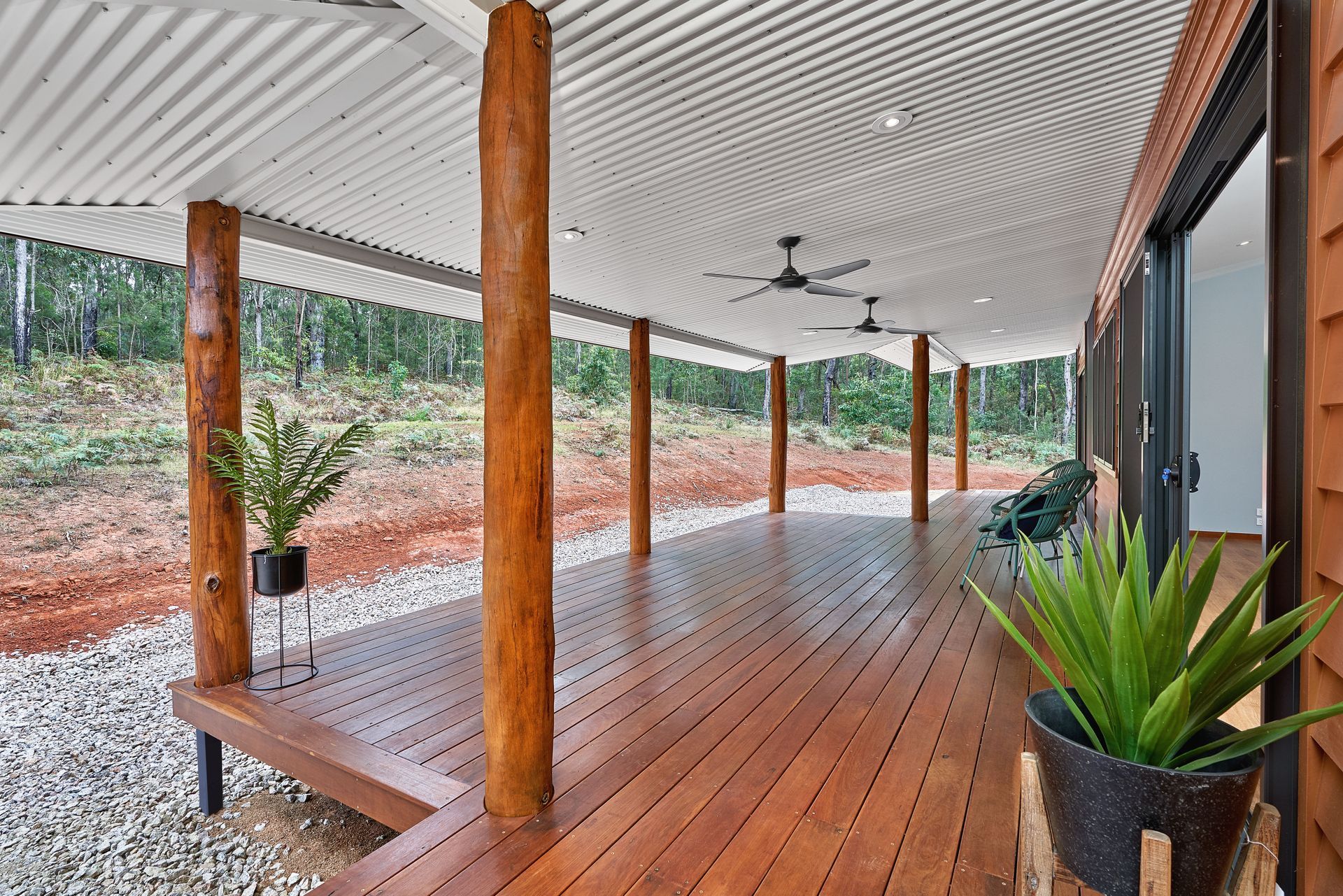 A Large Couch On A Wooden Deck — ROGA Build Solutions in Atherton, QLD