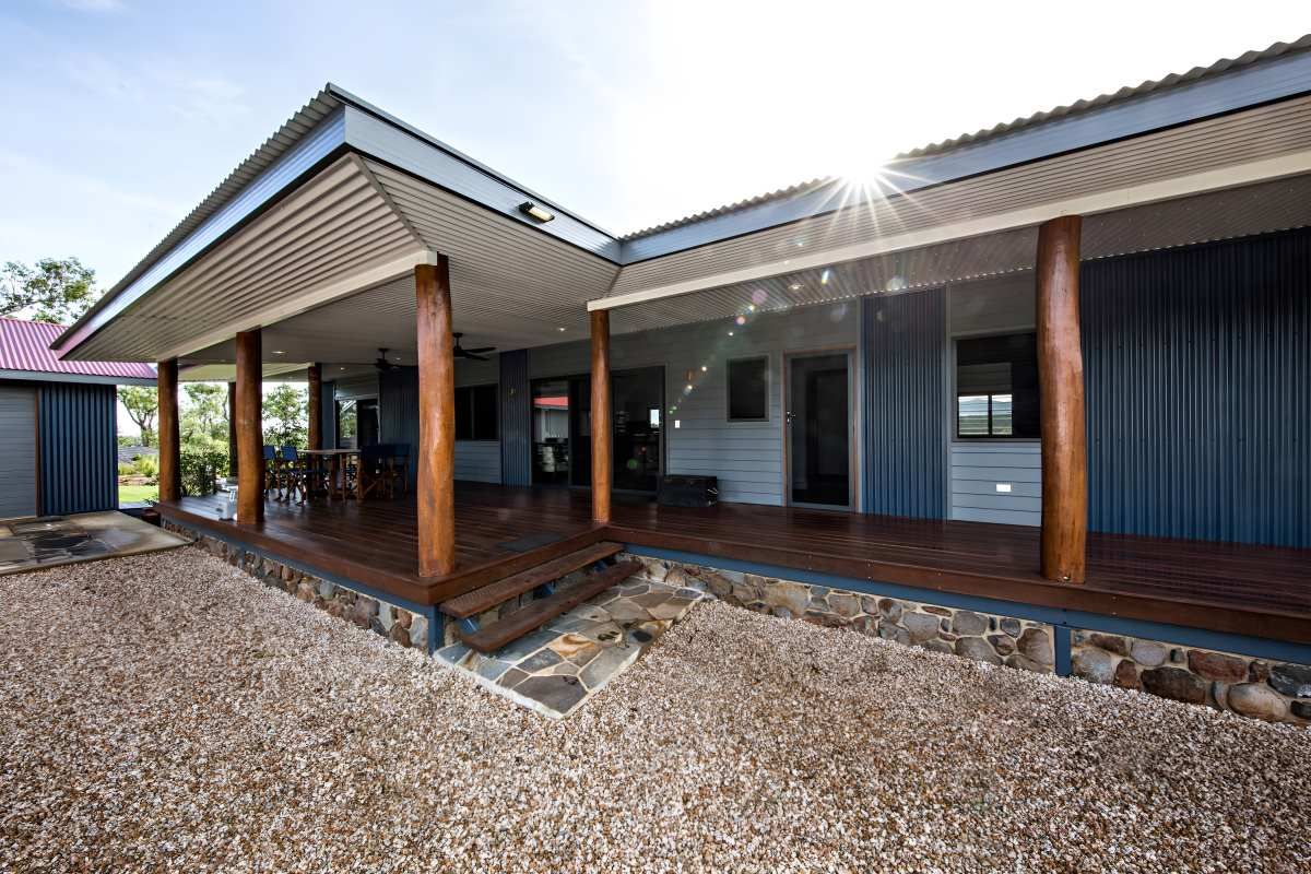 The Sun is Shining Through the Windows of a House With a Large Porch — ROGA Build Solutions in Atherton, QLD