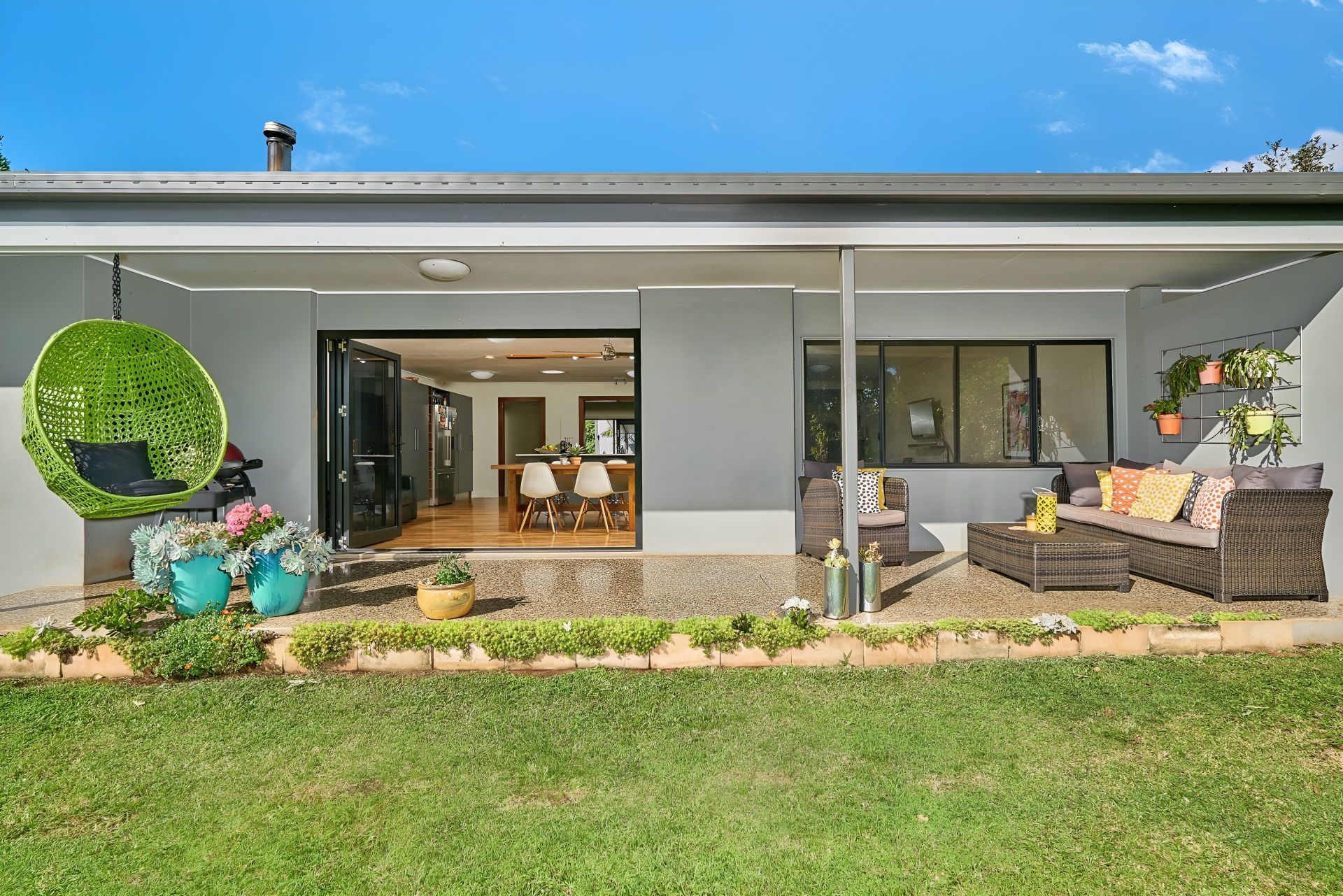 A Kitchen Looking Out To A Deck And A Lake — ROGA Build Solutions in Atherton, QLD
