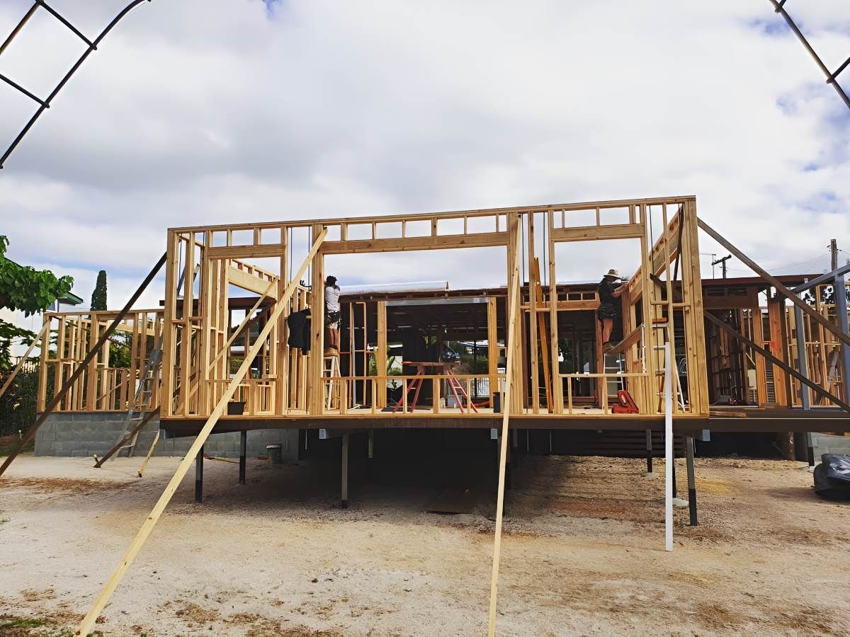 A Wooden House is Being Built in a Dirt Field — ROGA Build Solutions in Atherton, QLD