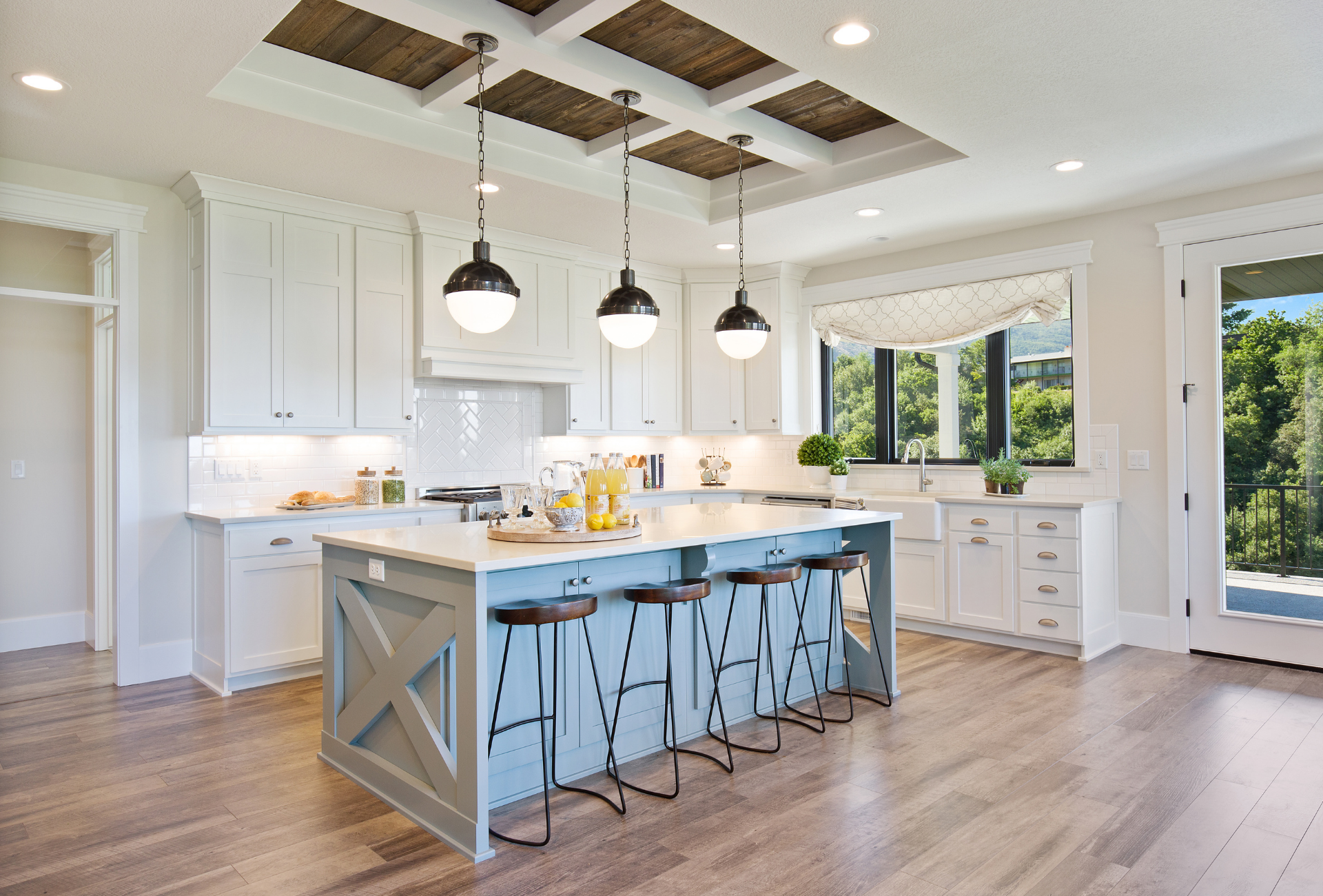 An empty living room with a fireplace and sliding glass doors.