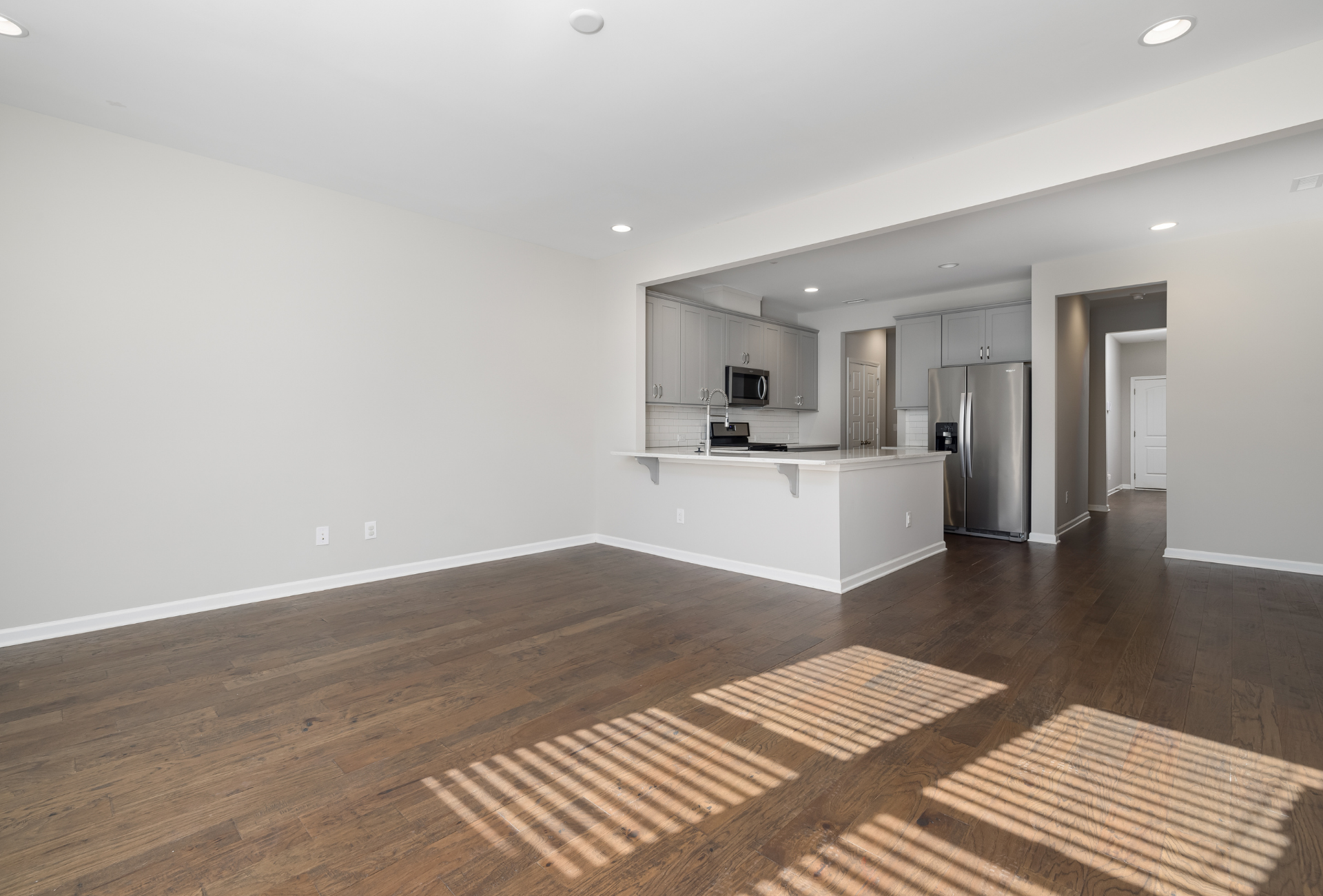 A person is cleaning a carpet with a sponge and a spray bottle.