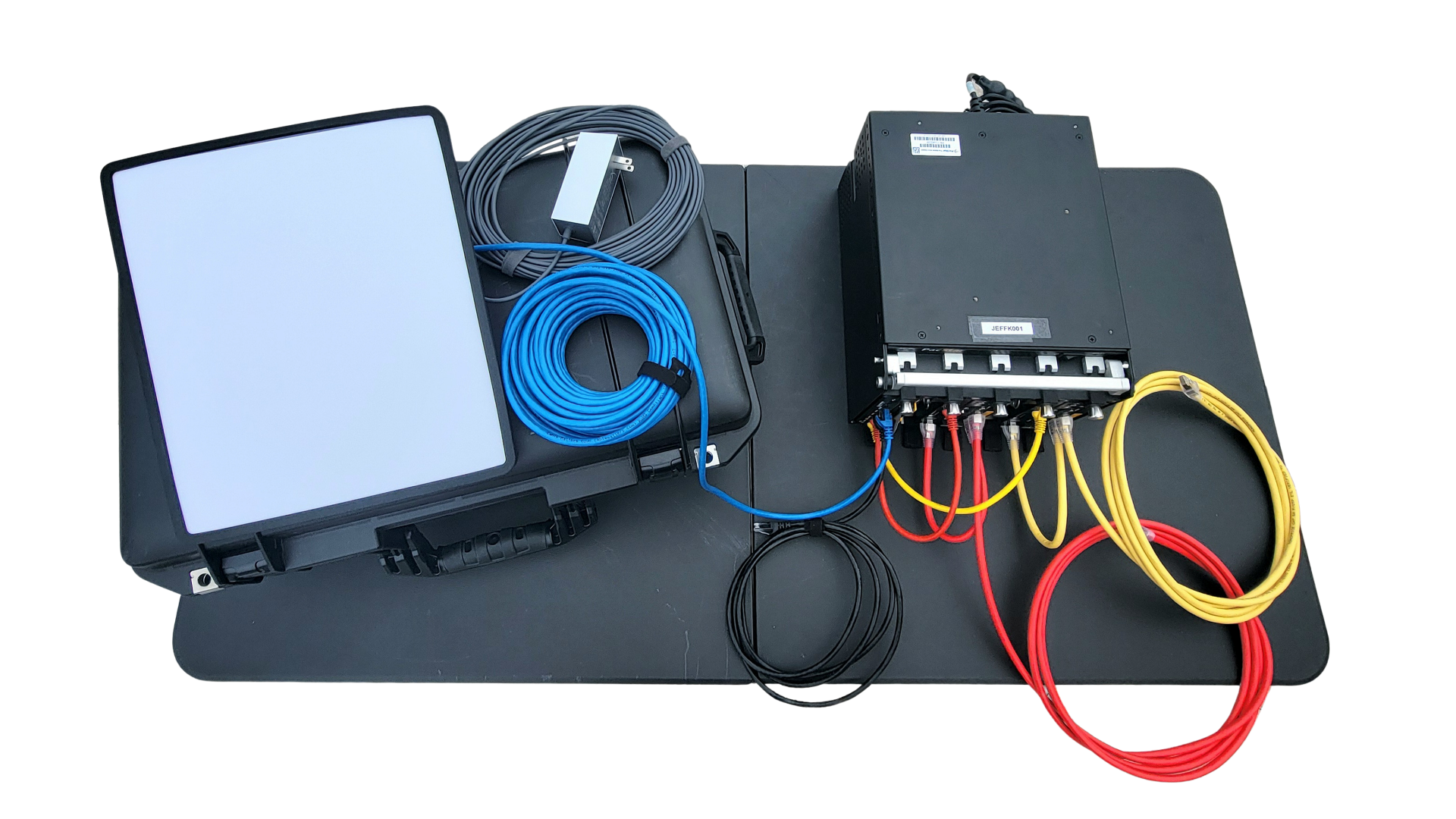 JEFF-K kit components — Starshield SATCOM terminal, Pelican carrying case, cabling, and the PacStar compute appliance labeled JEFFK001.