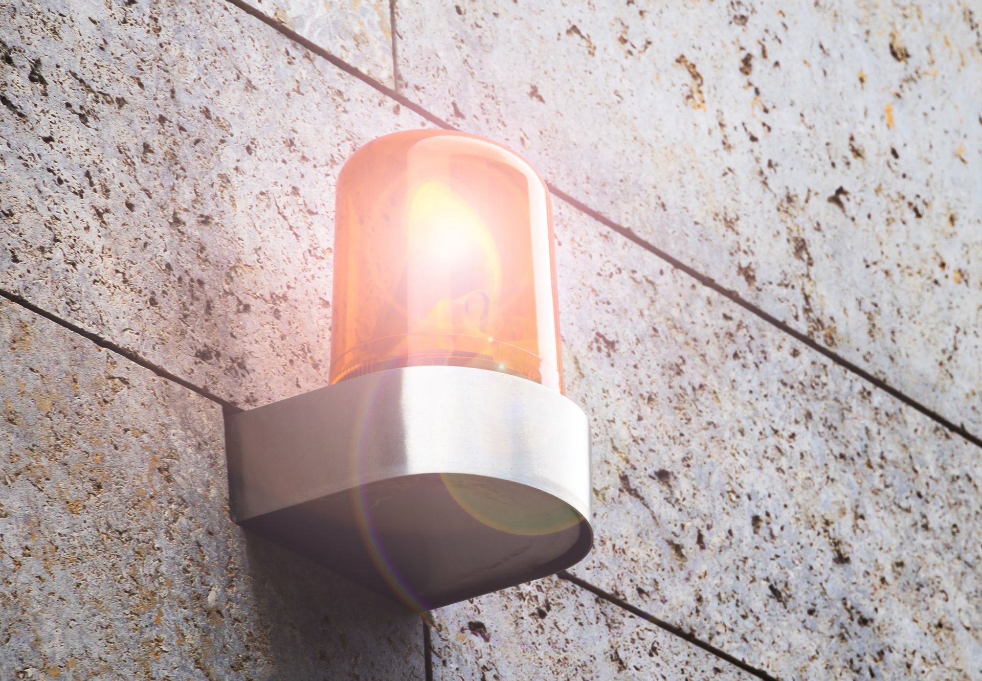 Alarm security system on a wall on an industrial building facade.