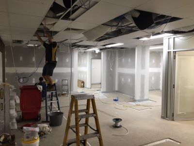 Worker Fixing Wires on Ceiling — Electrical Services in South Lismore, NSW