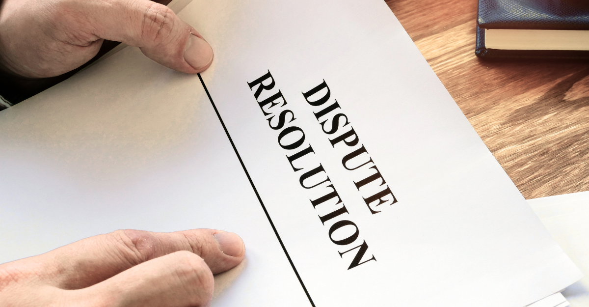 Hands exchanging a miniature house; a real estate transaction in sunlight.