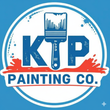 A blue and white logo for ktp construction