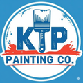 A blue and white logo for ktp construction