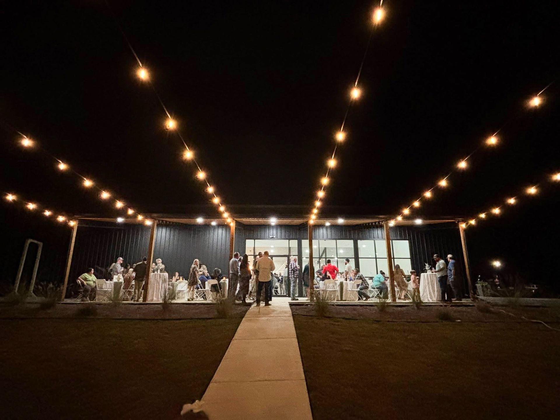 Outdoor wedding reception at night at the Barn at Baxter Farms
