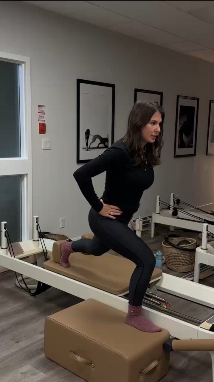 Private Pilates session at Two Sisters Pilates in Oakville with instructor guiding one on one reformer training for strength and posture