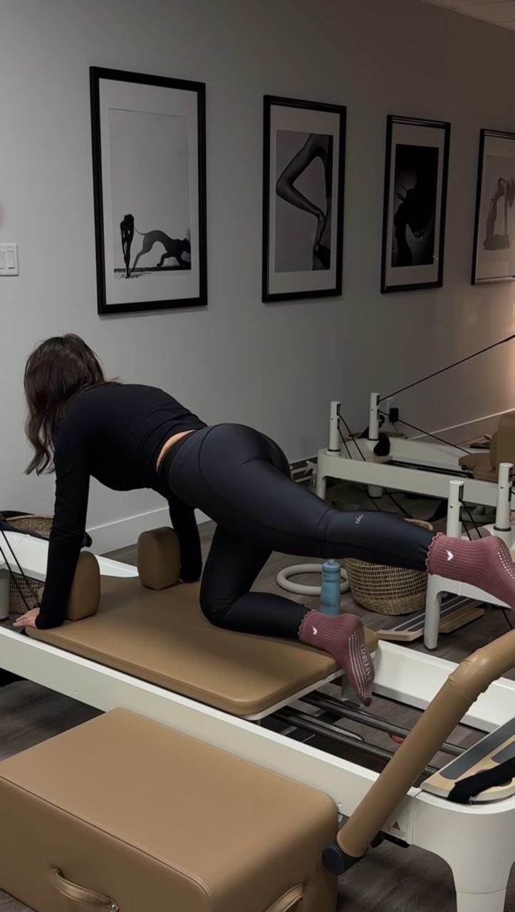 Private Pilates session at Two Sisters Pilates in Oakville with one on one coaching on the reformer to improve strength and mobility
