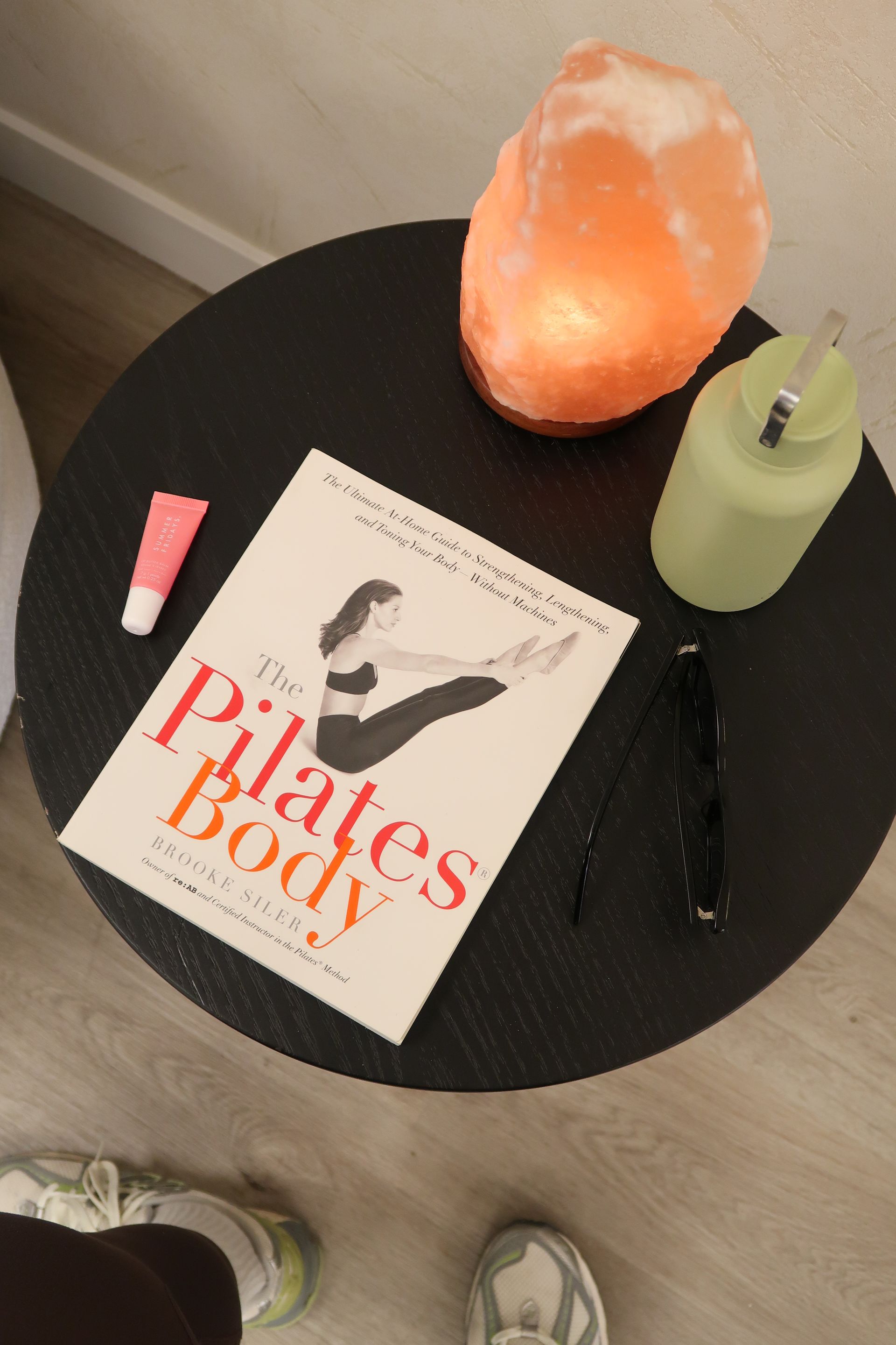 Wellness corner with Pilates book and salt lamp at Two Sisters Pilates studio in Oakville