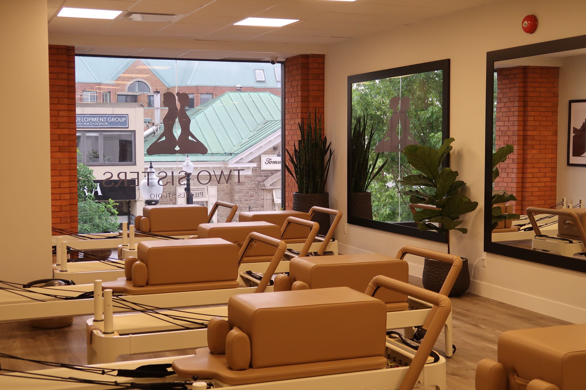 Empty reformer pilates studio with reformer machines