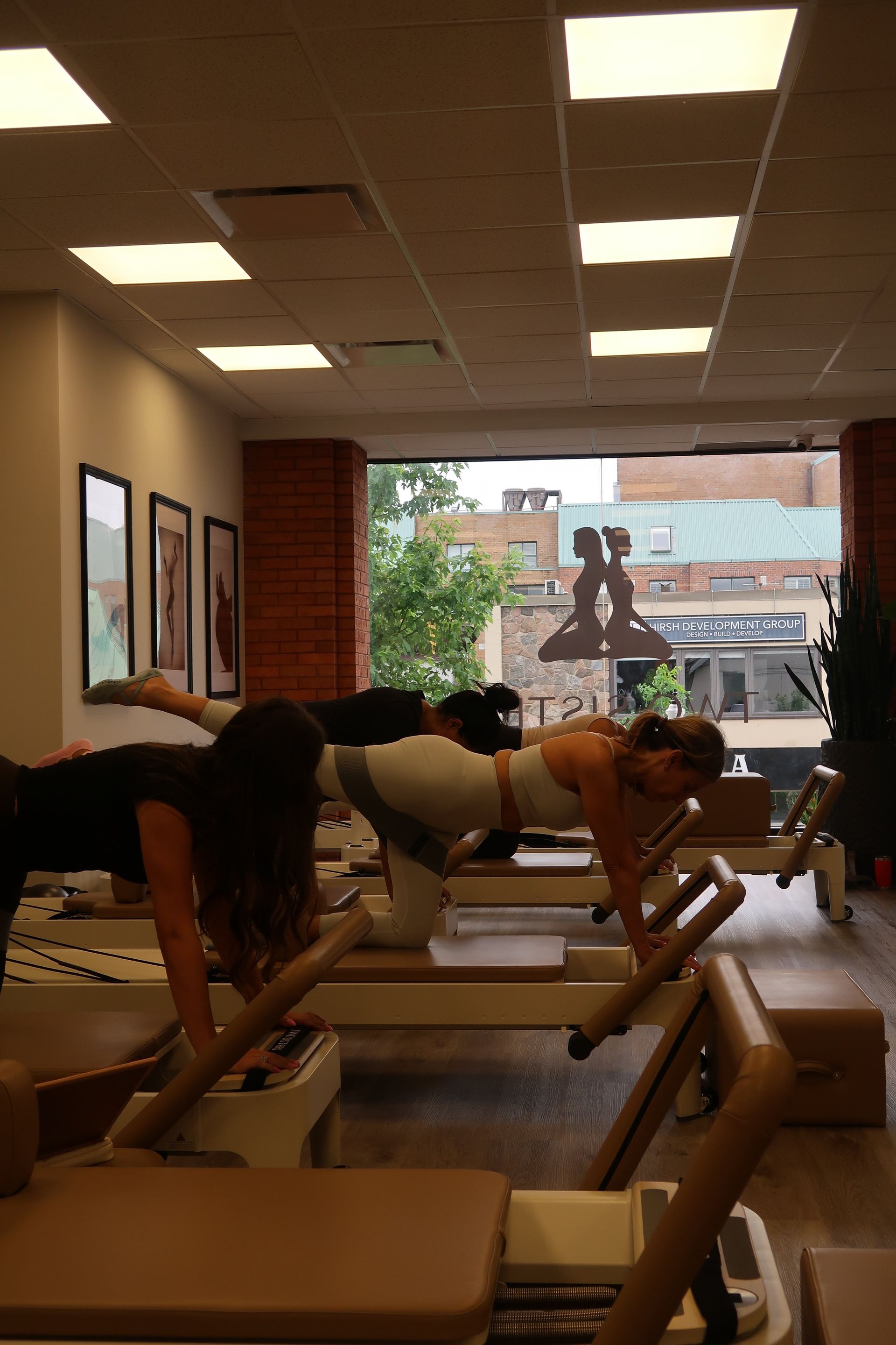Group Reformer pilates class taking place in oakville pilates studio