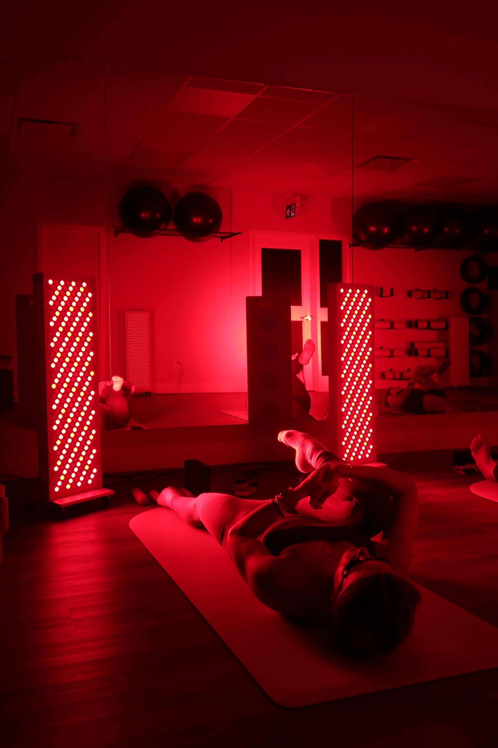 Red light therapy studio with fitness equipment at Two Sisters Pilates in Oakville