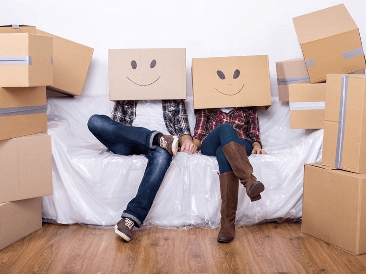 Couple With Boxes on Head — Expert Removalists In Ballina NSW