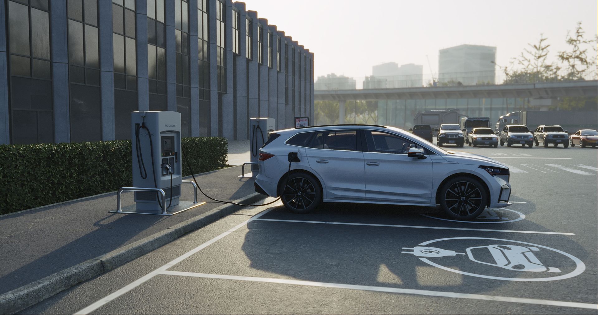 A white electric car is being charged at a charging station.