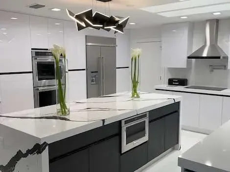 There is a large island in the middle of the kitchen.