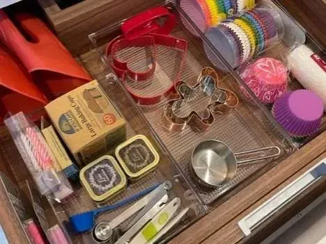 A drawer filled with a variety of baking supplies.