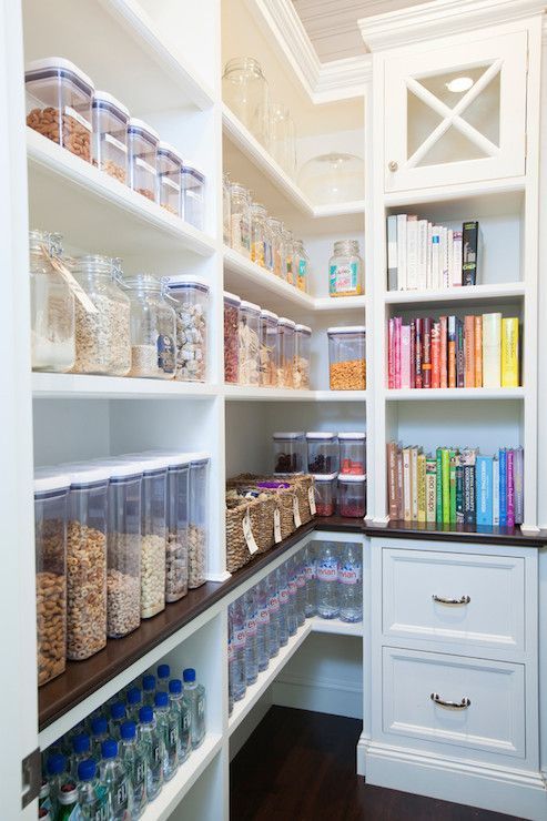 A pantry filled with lots of food and books.
