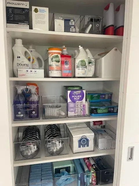 A pantry filled with lots of cleaning supplies and cleaning products.