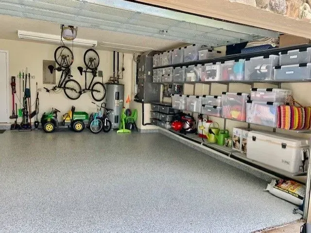 A garage filled with lots of toys and bicycles.