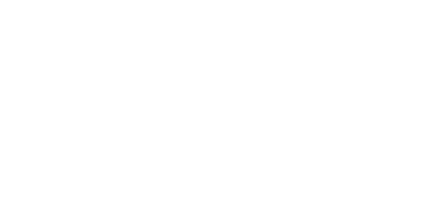 A close-up of a person's hand holding a single, vibrant yellow bell pepper against a solid, light blue background.