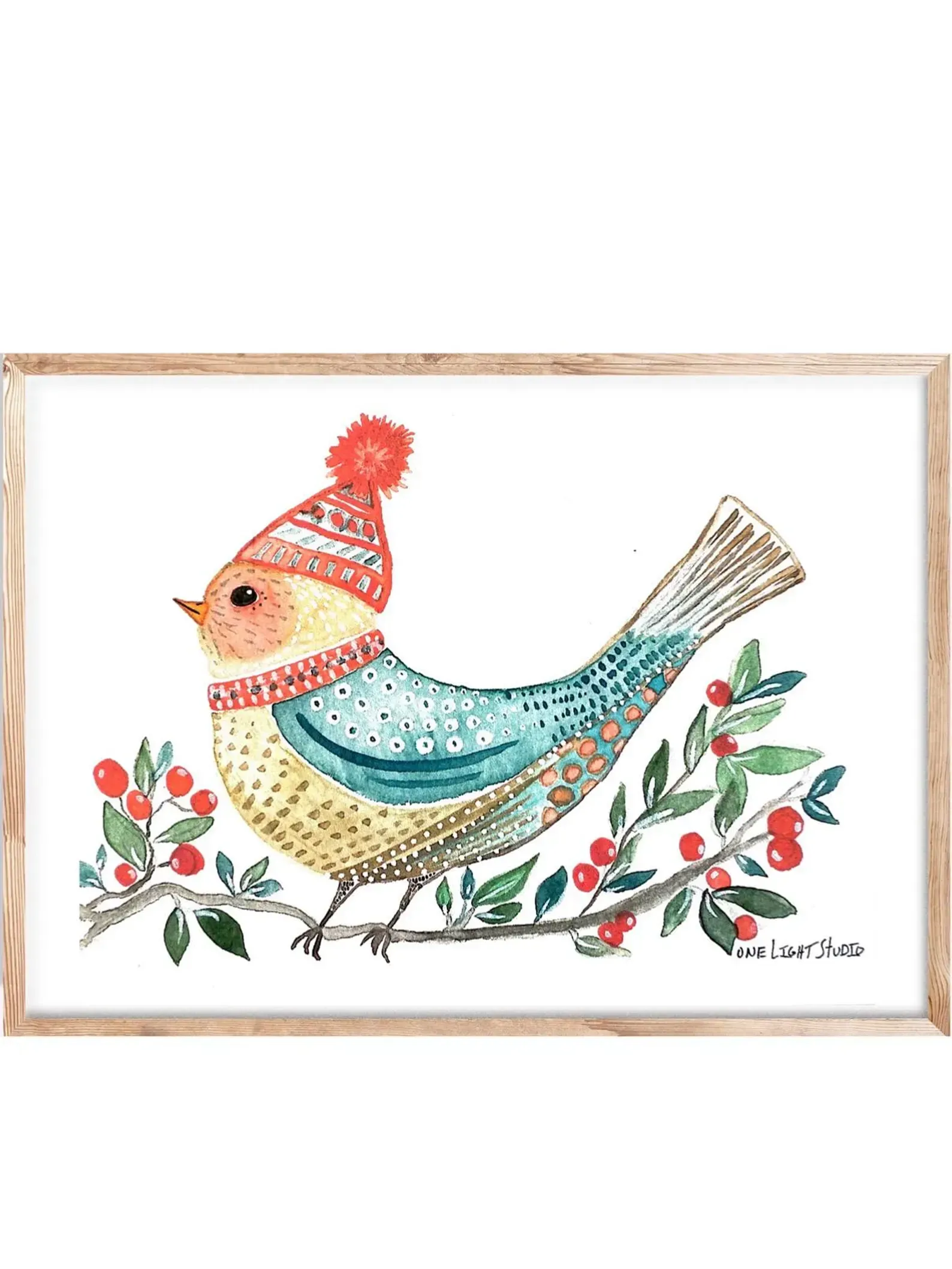 Watercolor bird wearing a winter hat and scarf, perched on a berry branch, framed in wood.