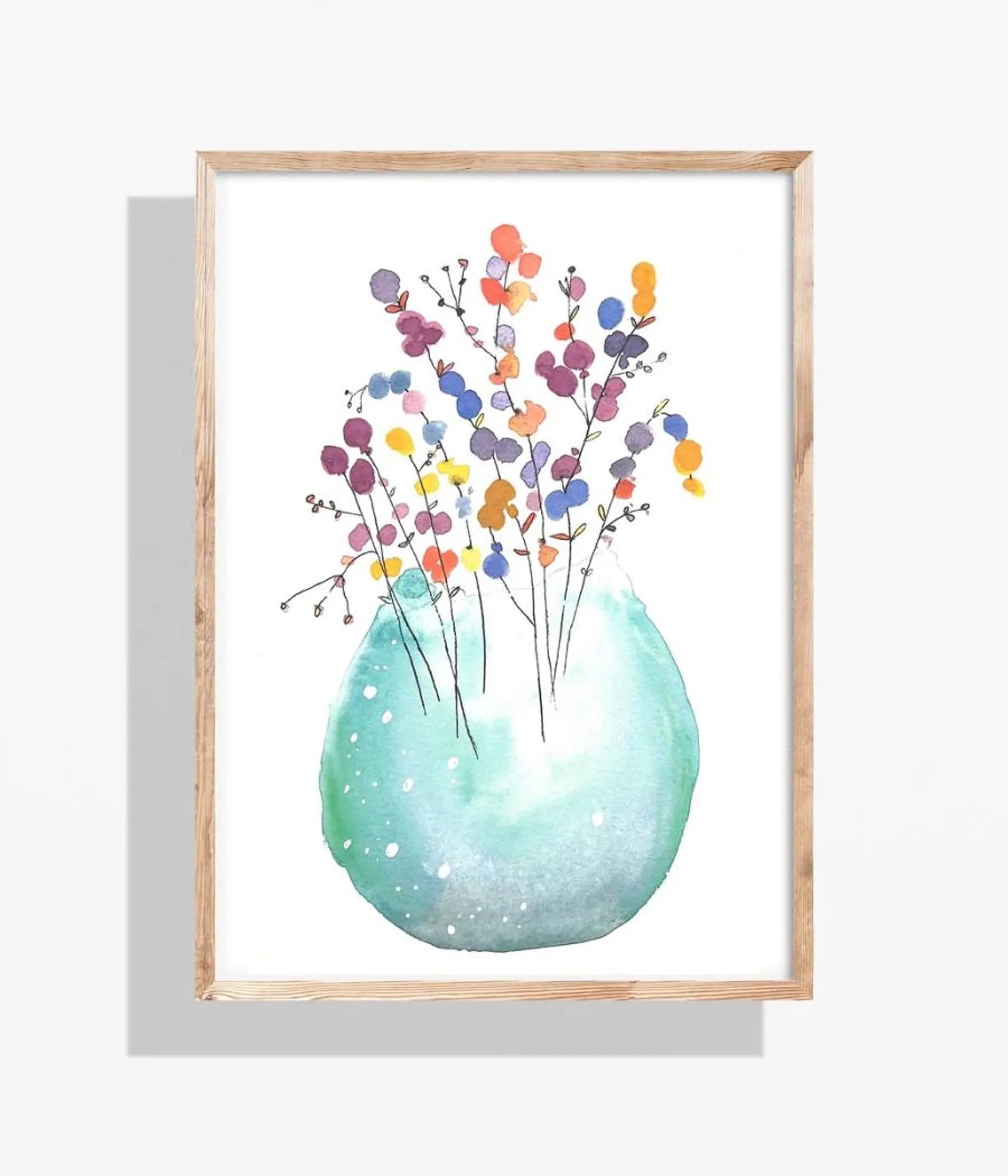 Watercolor painting of colorful flowers in a teal vase, framed in light wood.