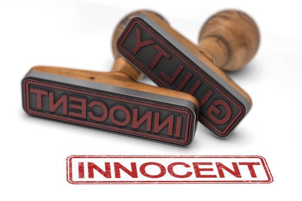 Two stamps with the word innocent written on them.